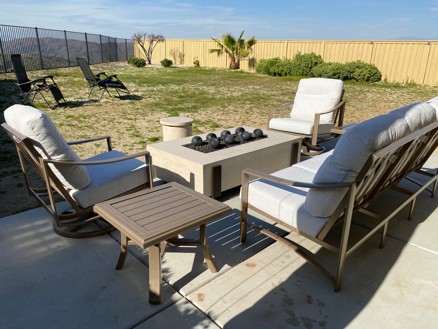60" x 36" American Fyre Designs Iron Saddle Firepit Travertine 580-TR-11-M7