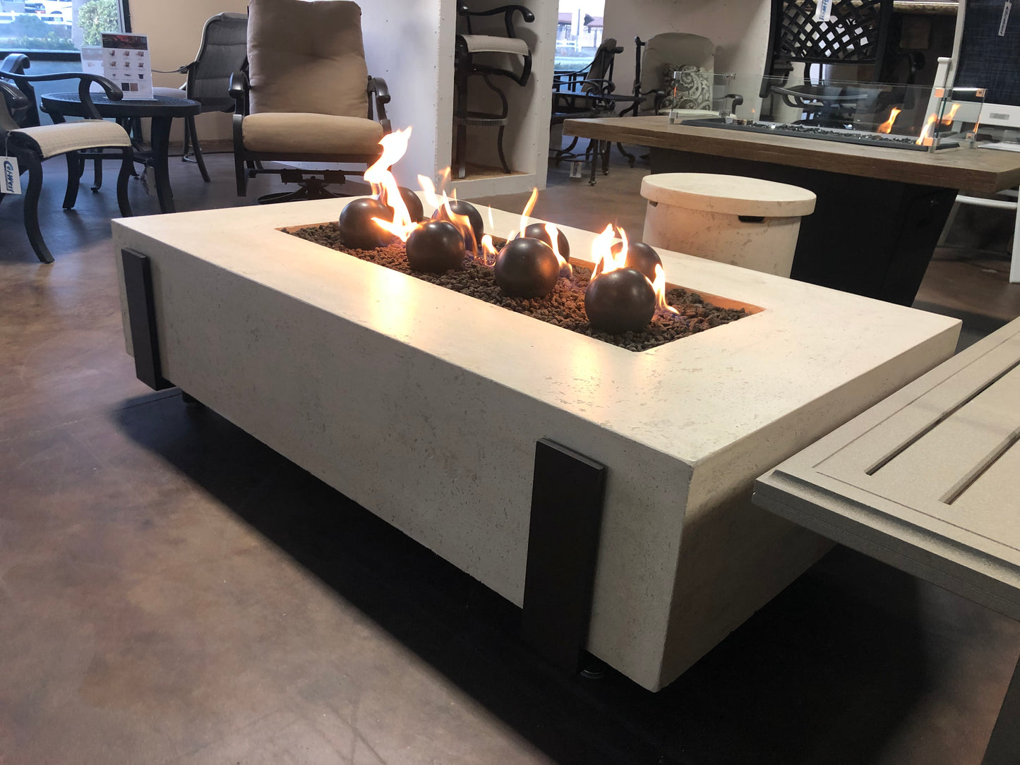 60" x 36" American Fyre Designs Iron Saddle Firepit Travertine 580-TR-11-M7