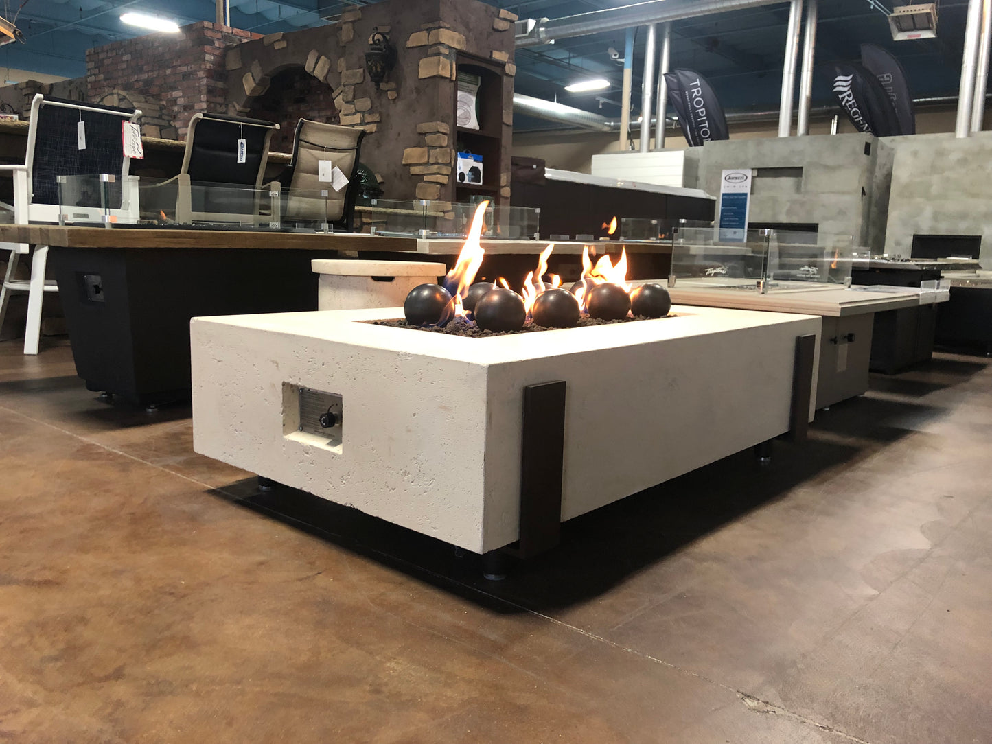 60" x 36" American Fyre Designs Iron Saddle Firepit Travertine 580-TR-11-M7