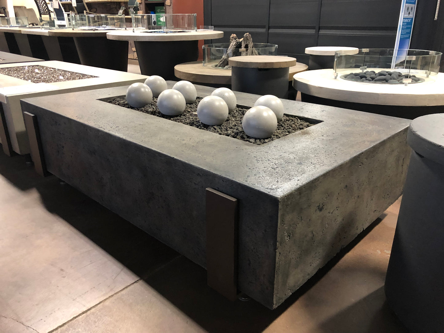 60" x 36" American Fyre Designs Iron Saddle Firepit Dark Bassalt 580-DB-11-M7