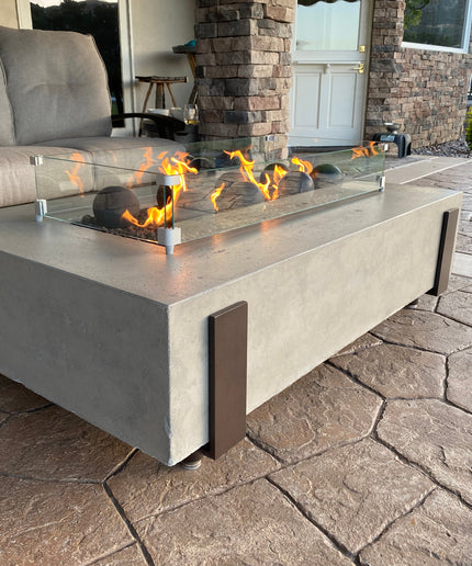 American Fyre Designs 60"W x 36"D x 17"H Iron Saddle Firepit Package w/ Lava, Spheres, Wind Guard & Cover - Light Bassalt (NG)