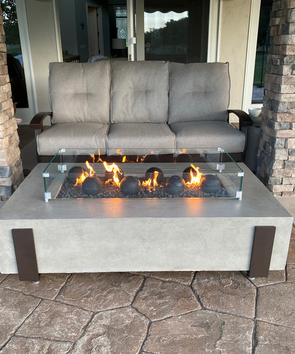 American Fyre Designs 60"W x 36"D x 17"H Iron Saddle Firepit Package w/ Lava, Spheres, Wind Guard & Cover - Light Bassalt (NG)