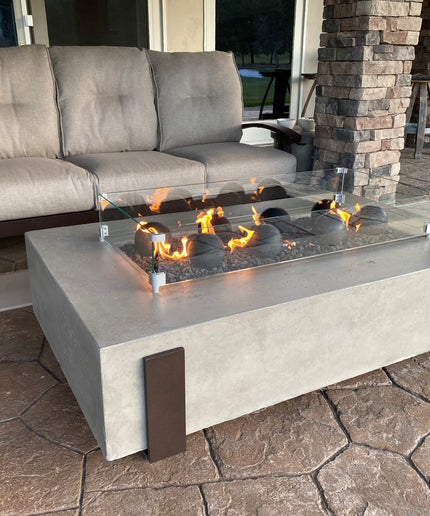 American Fyre Designs 60"W x 36"D x 17"H Iron Saddle Firepit Package w/ Lava, Spheres, Wind Guard & Cover - Light Bassalt (NG)